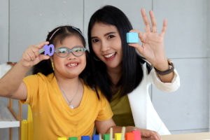 Disabled kids classroom, children having fun during study at sch