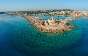 Aerial birds eye view drone photo of Rhodes city island, Dodecanese, Greece. Panorama with Mandraki port, lagoon and clear blue water. Famous tourist destination in South Europe